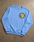 Blue Doodledukky 2 crew sweatshirt, front showing small duck chest emblem
